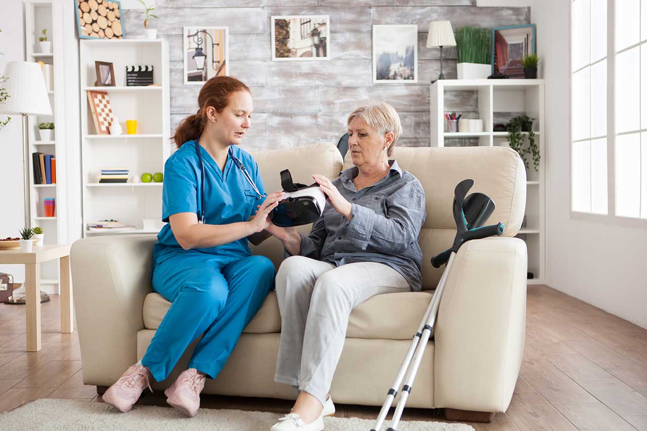Support worker demonstrating an assistive device