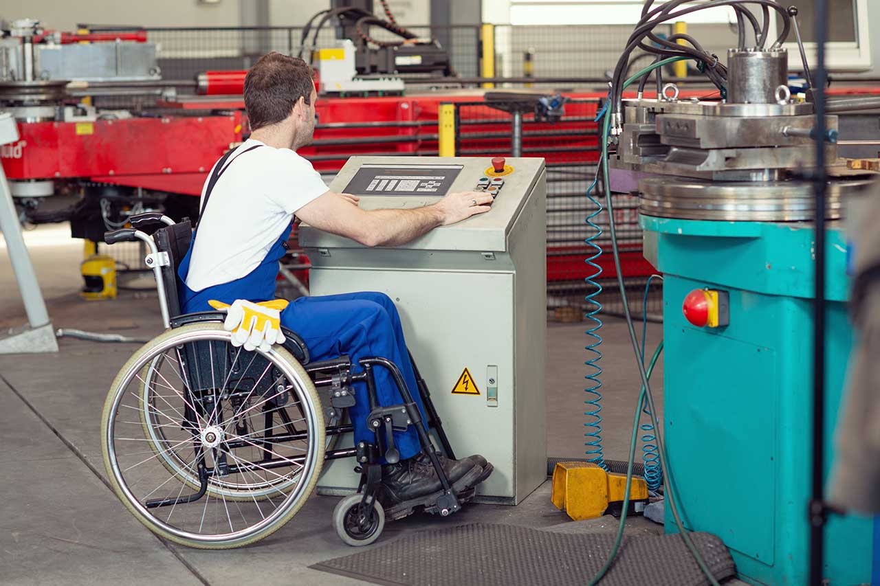 Worker operating machinery in a workshop