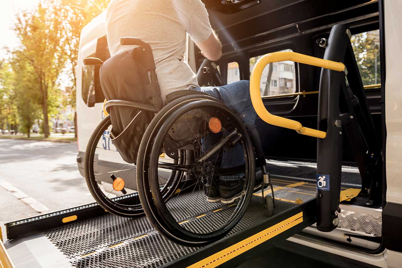 Wheelchair user boarding an accessible vehicle